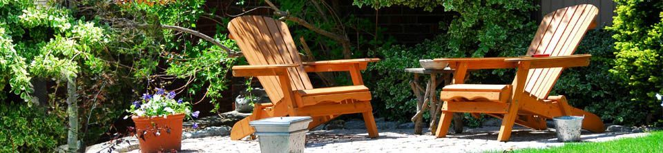 Adirondack chairs and other natural wood patio furniture                                                                                                                                                                                                       